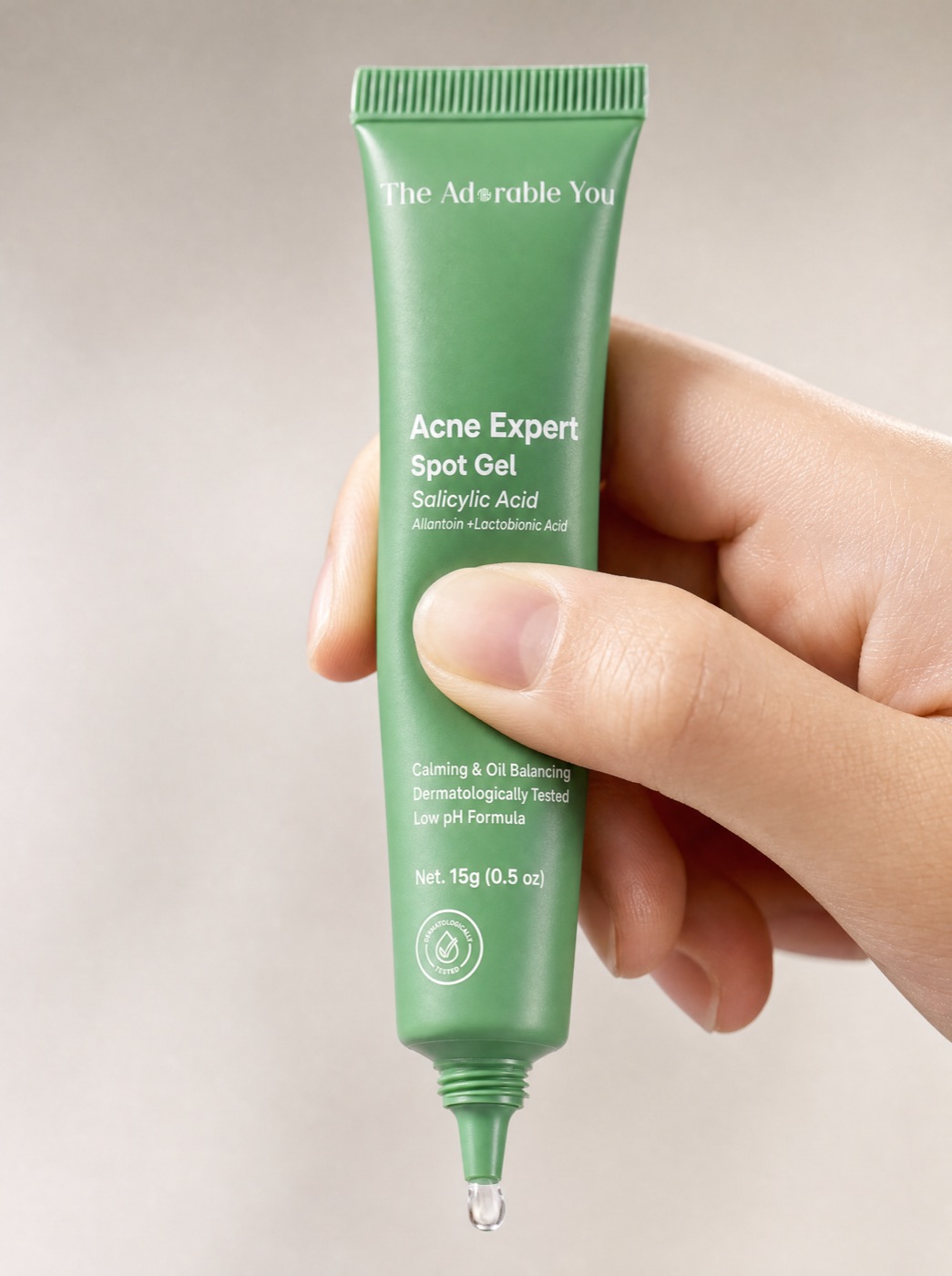 Holding the Acne Expert Spot Gel tube